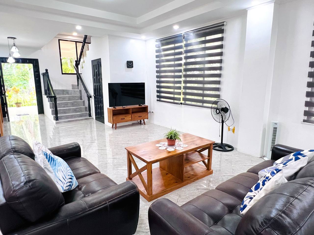 Ground floor sitting room in Grande Ground, opening to the garden
